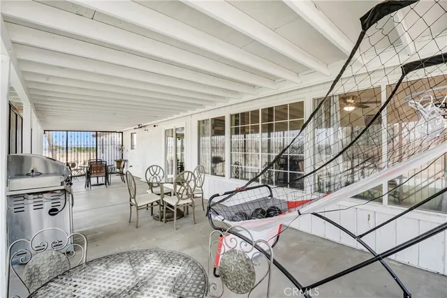a view of a livingroom with furniture and white walls