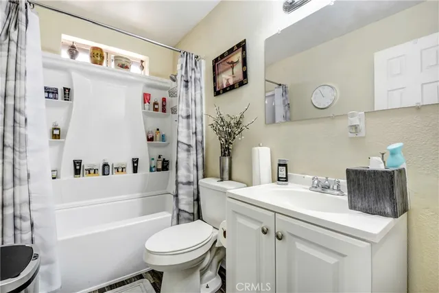a bathroom with a sink a toilet and a bathtub