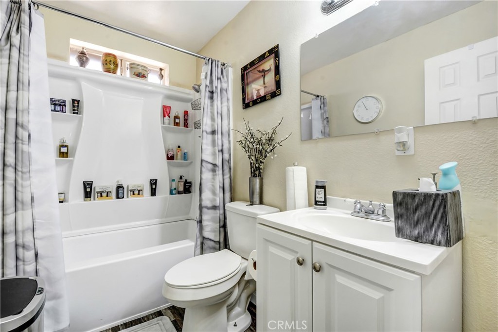 10015 High Road Lucerne Valley, CA 92356 - Photo 15 of 39 a bathroom with a sink a toilet and a bathtub