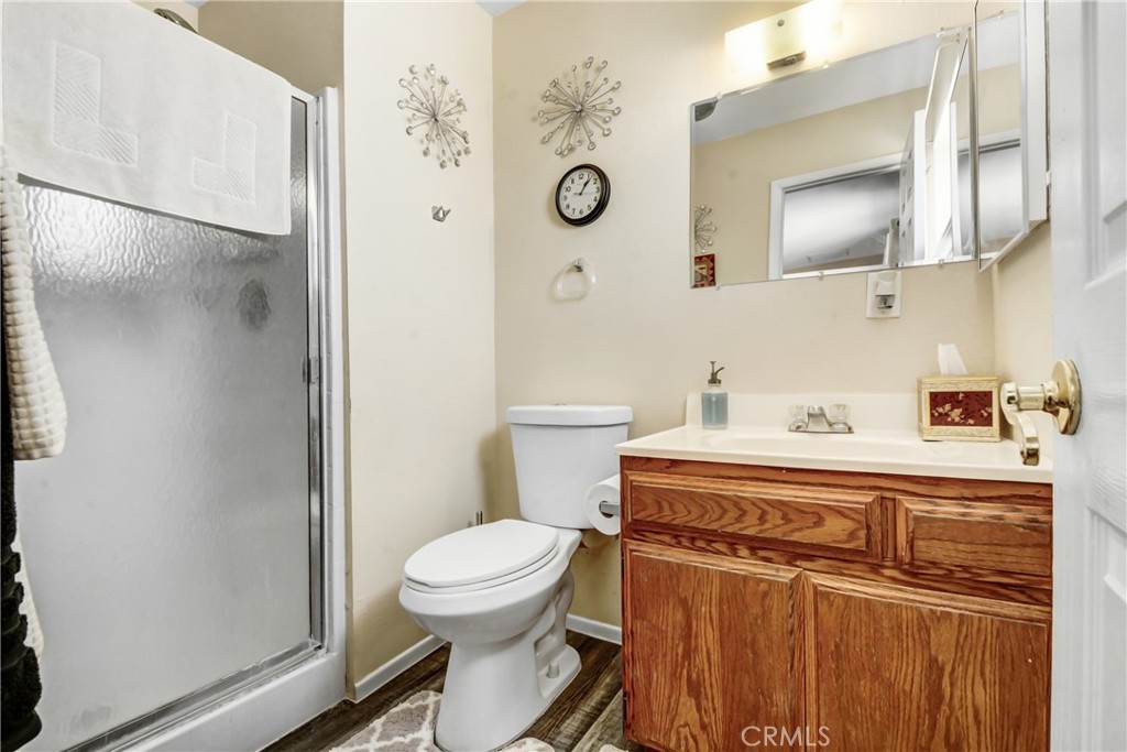 10015 High Road Lucerne Valley, CA 92356 - Photo 20 of 39 a bathroom with a toilet a sink and mirror