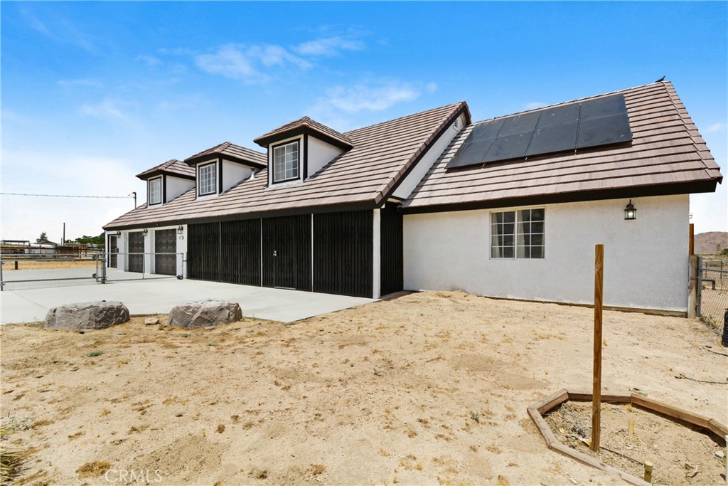 10015 High Road Lucerne Valley, CA 92356 - Photo 2 of 39 a front view of a house with a yard
