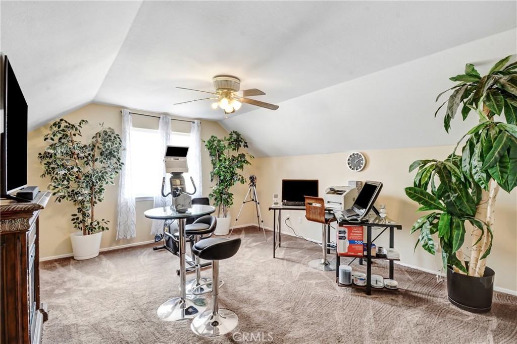 10015 High Road Lucerne Valley, CA 92356 - Photo 23 of 39 a living room with furniture a potted plant and a chandelier
