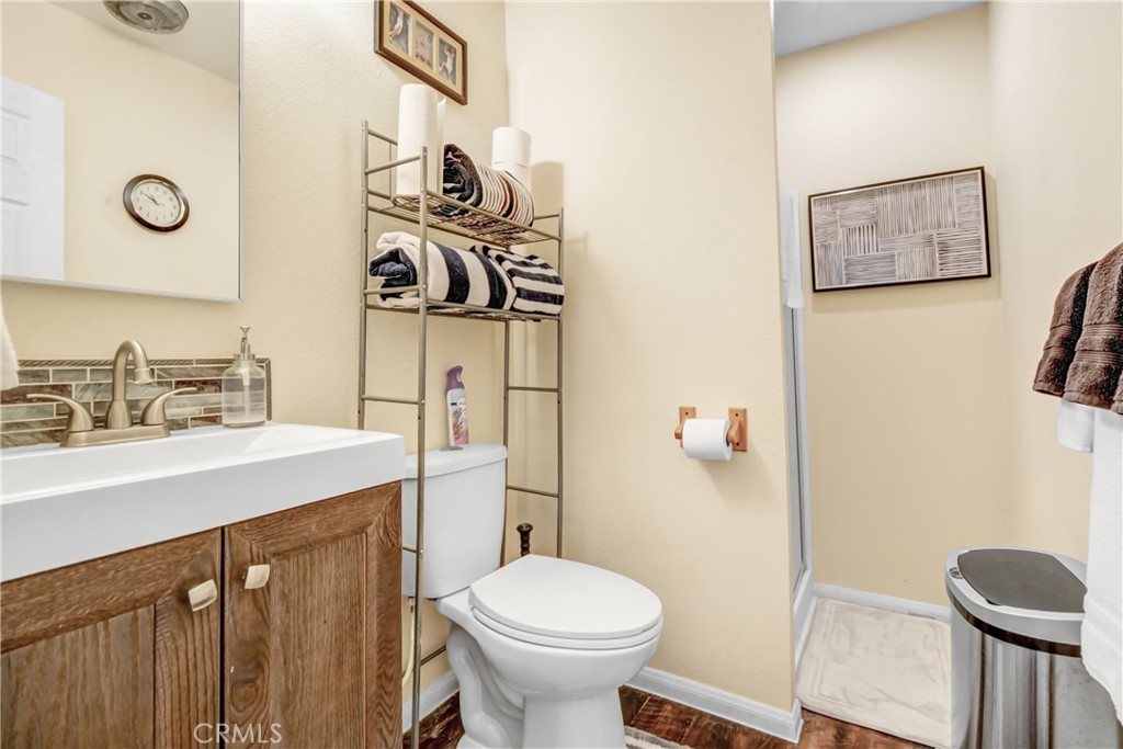 10015 High Road Lucerne Valley, CA 92356 - Photo 24 of 39 a bathroom with a toilet sink and mirror