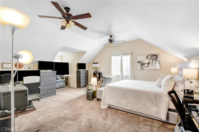 a bedroom with a bed gym equipment and a fireplace