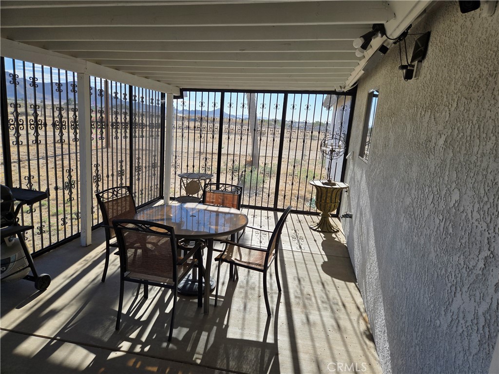 10015 High Road Lucerne Valley, CA 92356 - Photo 33 of 39 a view of a dining room with furniture window and outside view