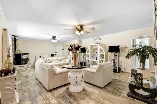 a living room with fireplace furniture and a flat screen tv