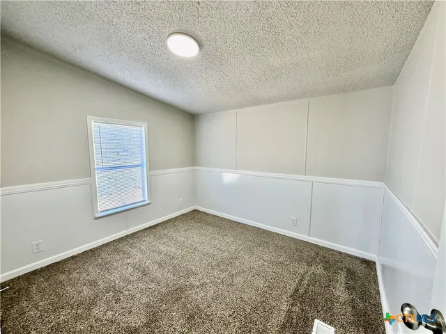 an empty room with a workbench