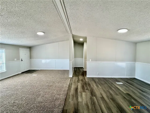 a view of a livingroom with wooden floor