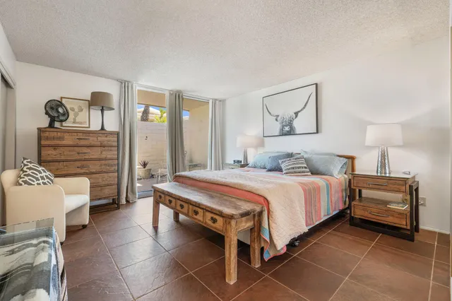 a view of bedroom with a small yard