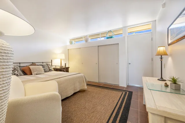 a view of a swimming pool with a lawn chairs