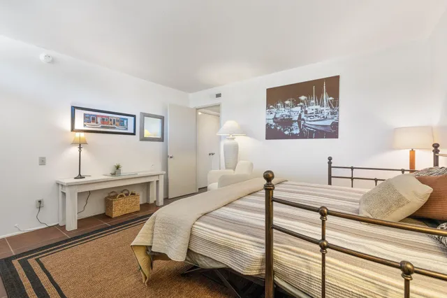a view of an chairs and table in the patio