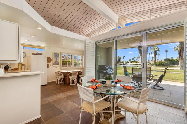 a room with furniture and a large window
