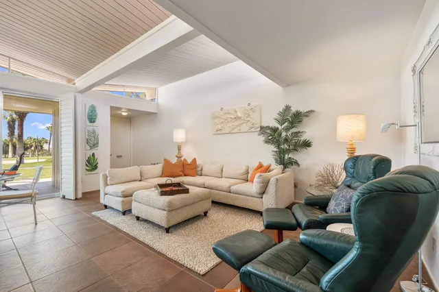 a kitchen with stainless steel appliances granite countertop a sink a stove and cabinets