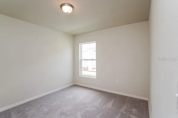 a bathroom with a granite countertop sink and a bathtub
