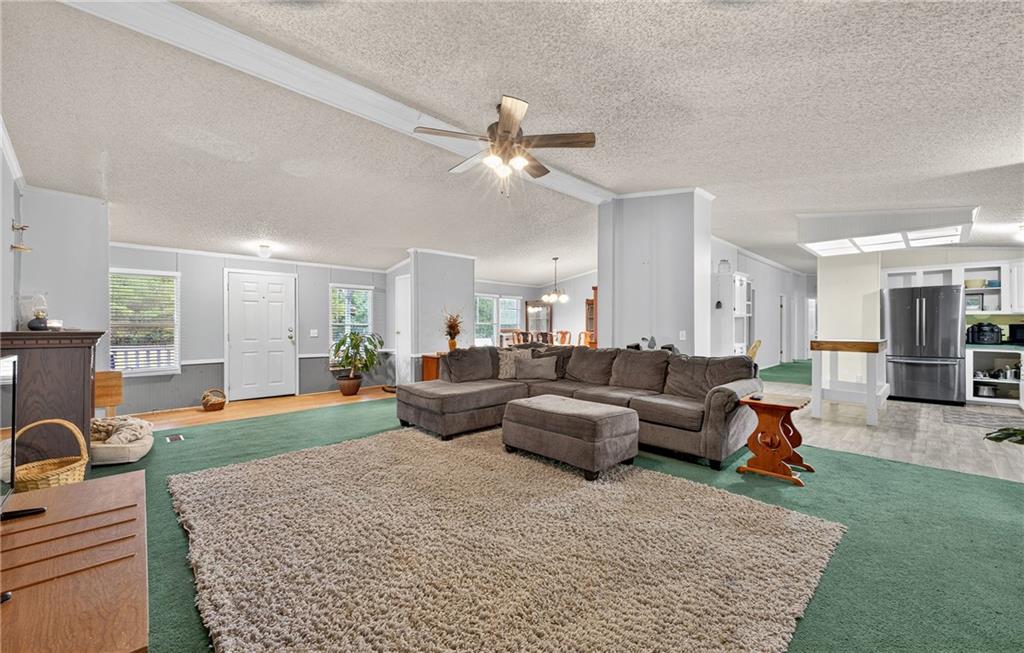 1090 South Hampton Road Hampton, GA 30228 - Photo 3 of 13 a living room with furniture and a couch