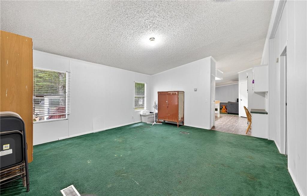1090 South Hampton Road Hampton, GA 30228 - Photo 6 of 13 a view of a livingroom with a workspace