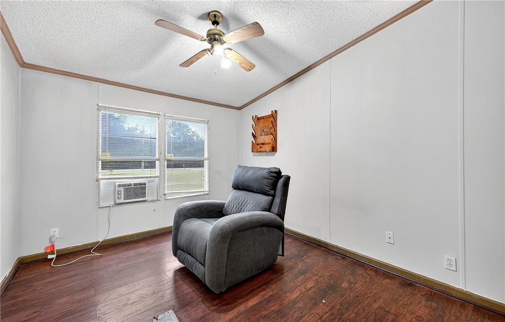 1090 South Hampton Road Hampton, GA 30228 - Photo 9 of 13 a living room with furniture and a window