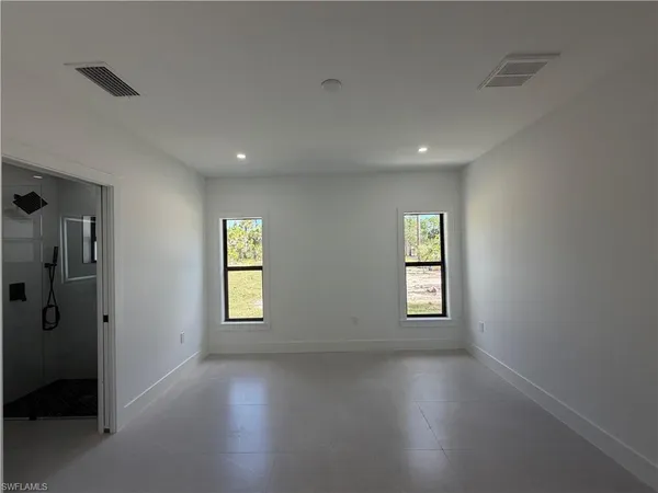 a view of empty room with windows