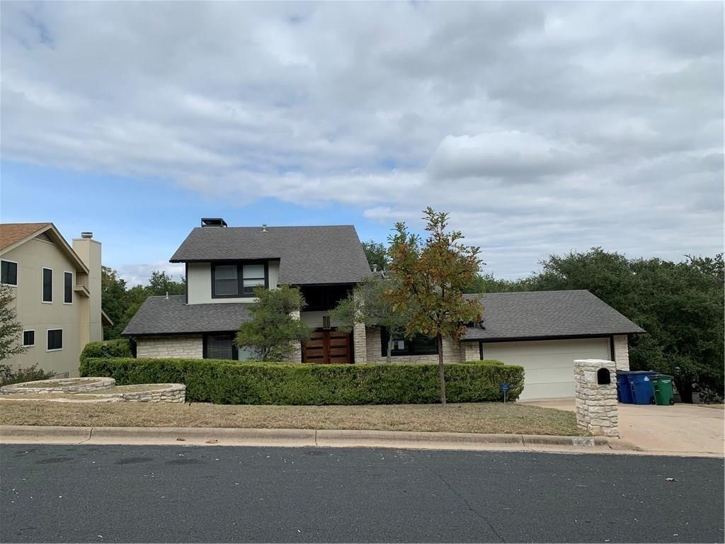 front view of a house with a street