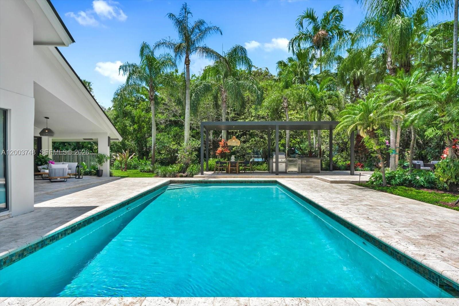 2675 Hackney Road Weston, FL 33331 - Photo 32 of 61 a view of swimming pool from a garden