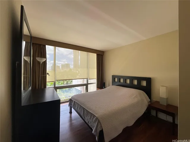 a view of a room with balcony and wooden floor