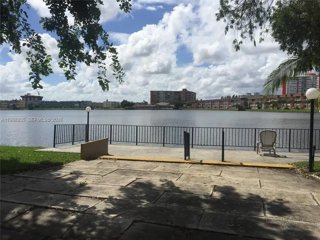 a view of a swimming pool with a lounge chair