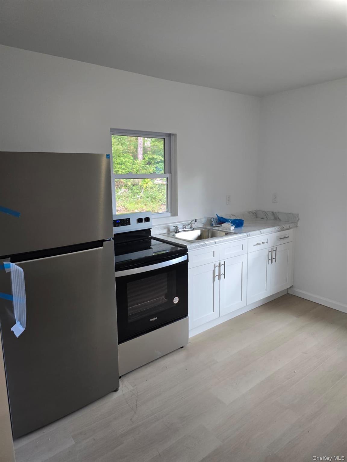 2016 Old Rte 17 Roscoe, NY 12776 - Photo 13 of 26 a kitchen with stainless steel appliances granite countertop a stove a sink and a refrigerator