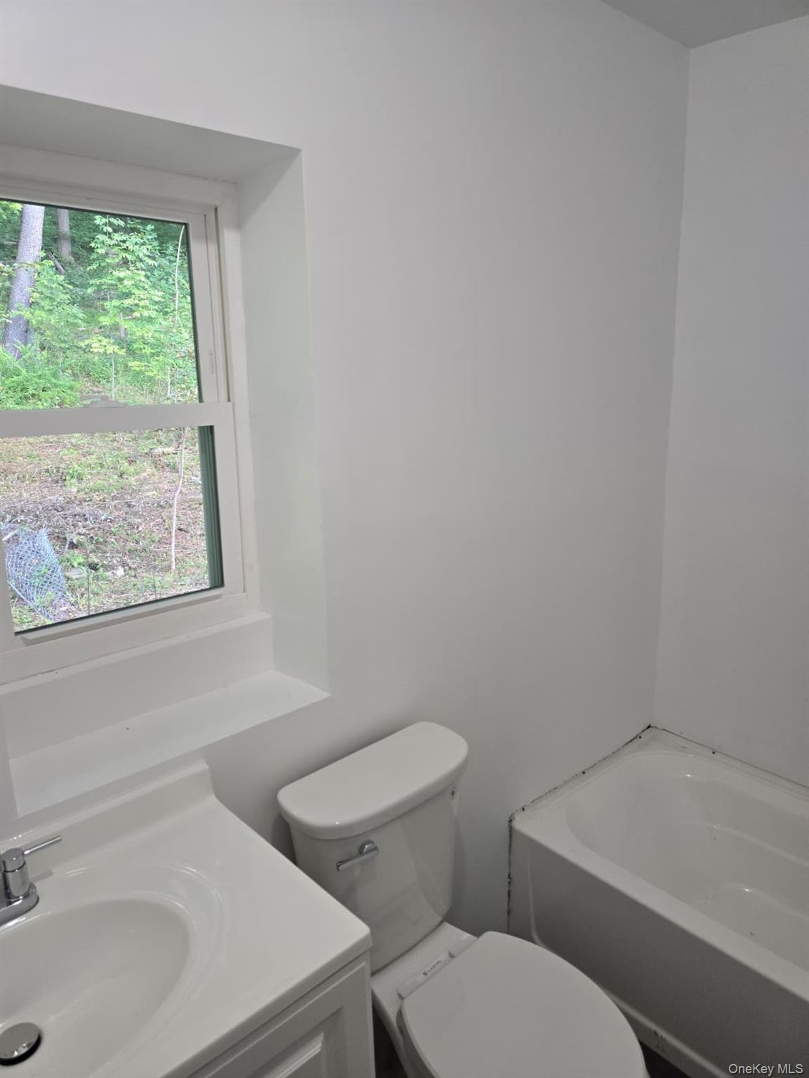 2016 Old Rte 17 Roscoe, NY 12776 - Photo 14 of 26 a white toilet sitting next to a bathroom sink
