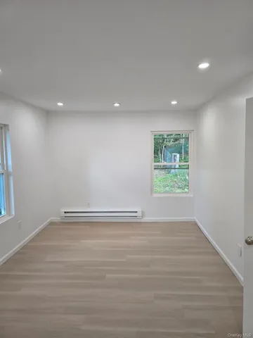 a view of a hallway with wooden shelves