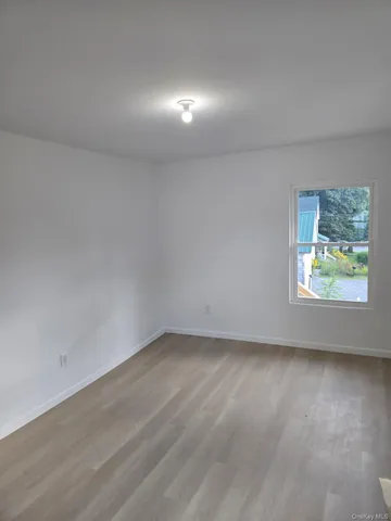 a view of hallway with bathroom