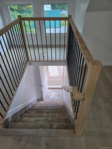 a metallic refrigerator freezer sitting in a kitchen