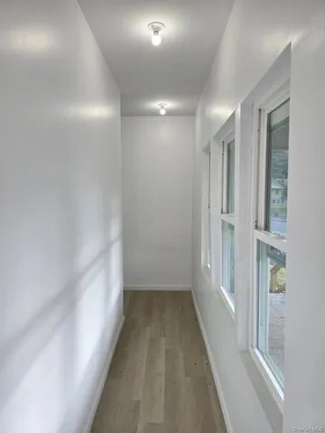 a kitchen with a refrigerator and window