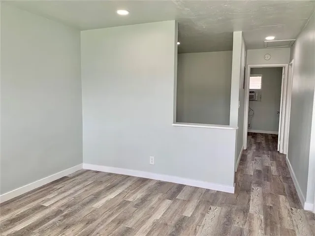 wooden floor in an empty room with a gallery