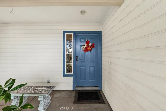 a view of front door with wooden floor