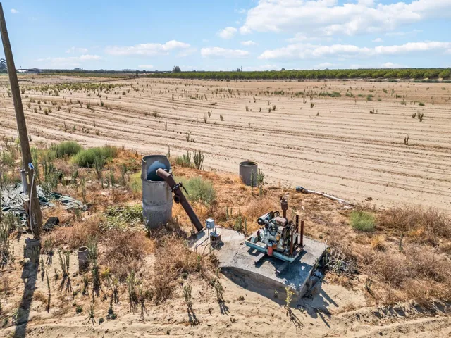 a front view of a house with a yard and chandelier