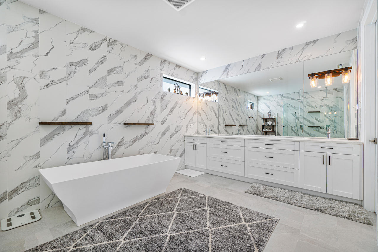 709 Northwest 6th Drive Boca Raton, FL 33486 - Photo 13 of 20 a bathroom with a tub sink and mirror