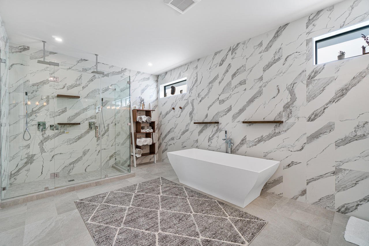 709 Northwest 6th Drive Boca Raton, FL 33486 - Photo 14 of 20 a bathroom with a bathtub and shower