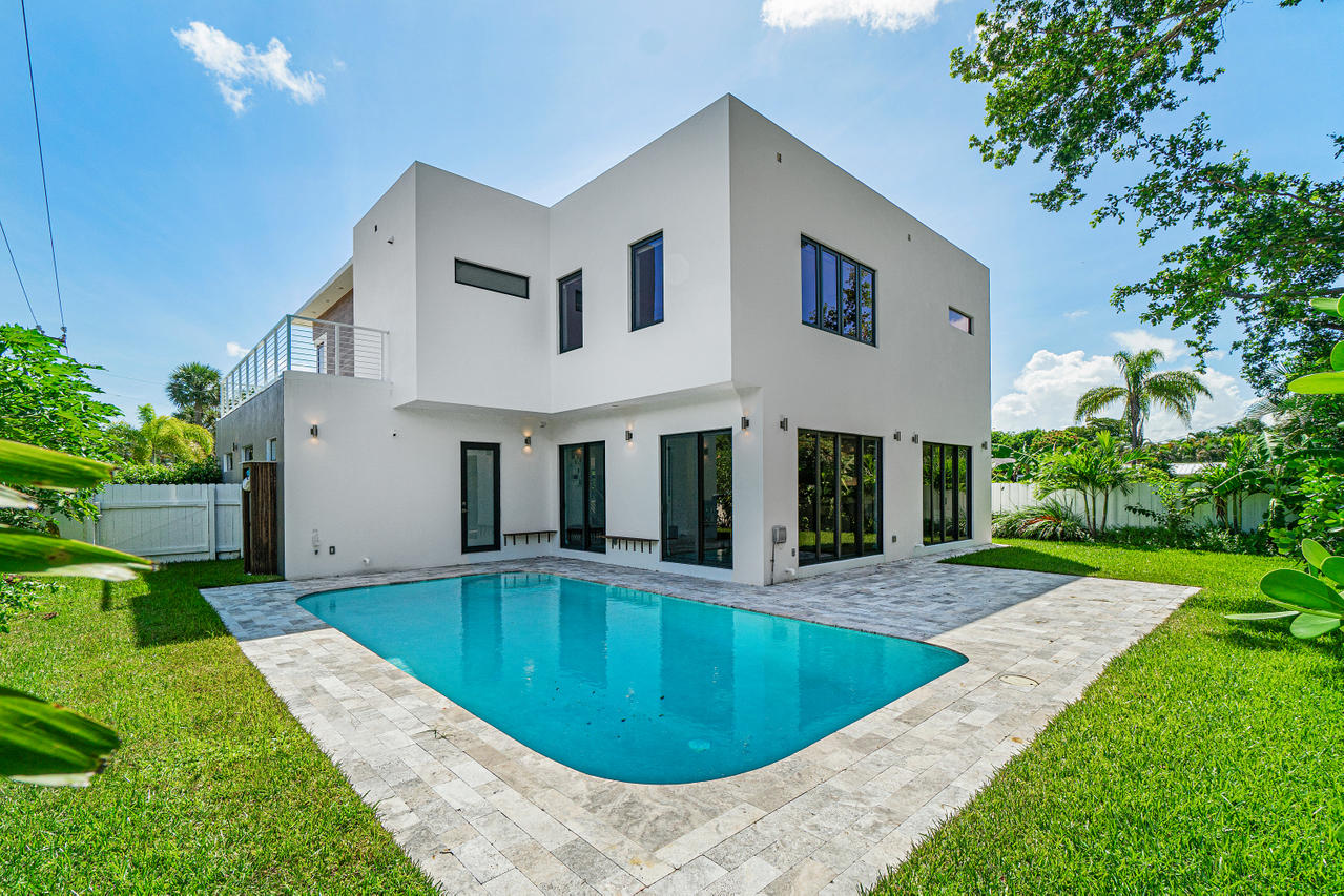 709 Northwest 6th Drive Boca Raton, FL 33486 - Photo 20 of 20 a view of a house with a swimming pool