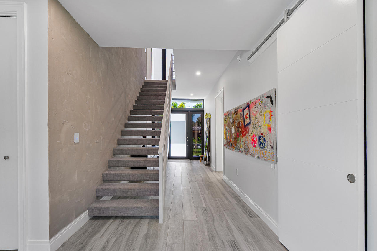 709 Northwest 6th Drive Boca Raton, FL 33486 - Photo 3 of 20 a view of entryway with wooden floor