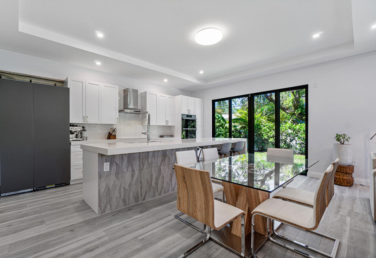 709 Northwest 6th Drive Boca Raton, FL 33486 - Photo 5 of 20 a view of a dining room with furniture window and outside view