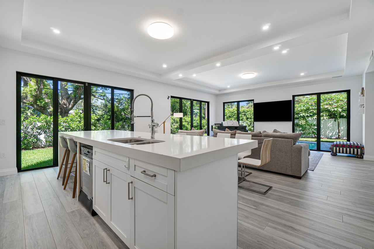 709 Northwest 6th Drive Boca Raton, FL 33486 - Photo 6 of 20 a large white kitchen with a large window