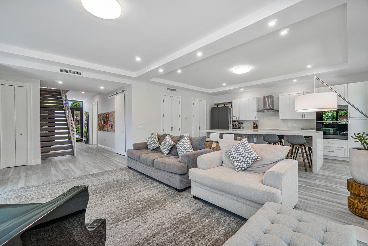 709 Northwest 6th Drive Boca Raton, FL 33486 - Photo 8 of 20 a living room with furniture and view of kitchen