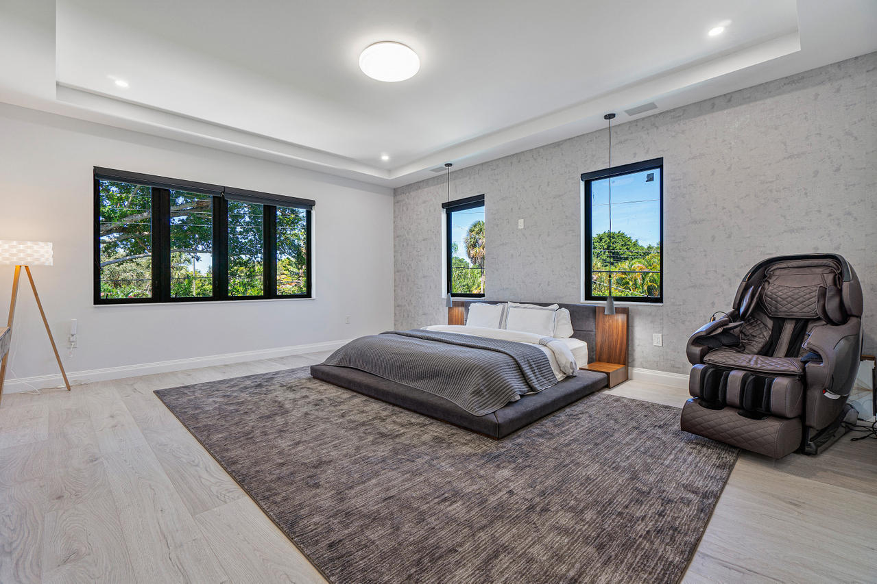 709 Northwest 6th Drive Boca Raton, FL 33486 - Photo 10 of 20 a bedroom with a bed and window