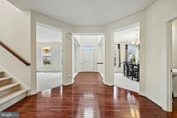 a view of a big room with wooden floor and a bathroom