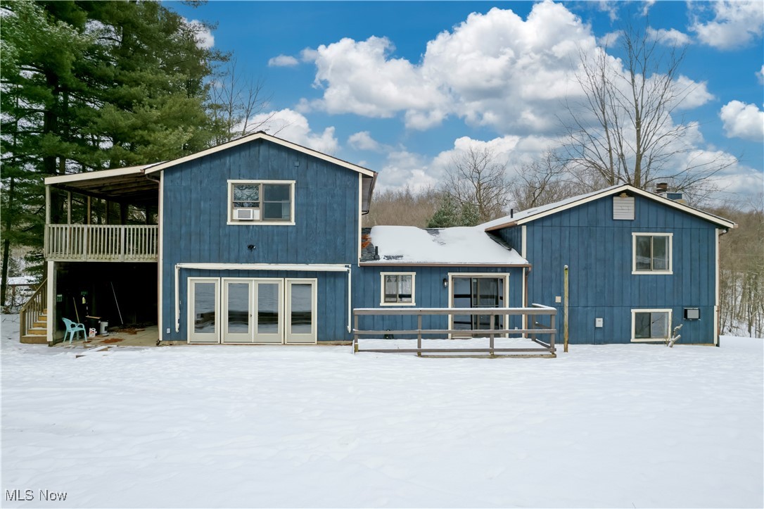 2781 North Firestone Road Wooster, OH 44691 - Photo 33 of 41 Snow covered house featuring a garage