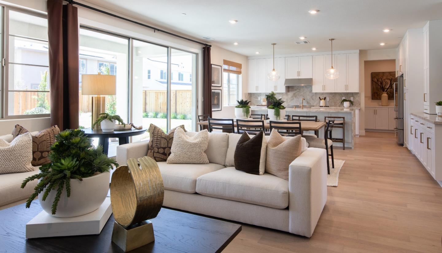 7351 Princevalle Street, Unit HOMESITE 18 Gilroy, CA 95020 - Photo 4 of 12 a living room with furniture wooden floor and a large window