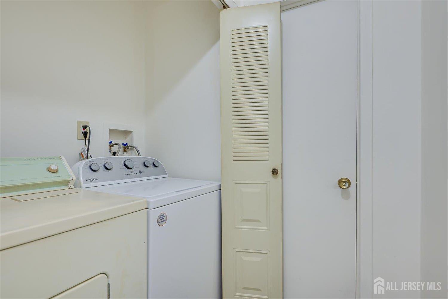 112 Redbud Road Piscataway, NJ 08854 - Photo 21 of 27 a utility room with dryer and washer