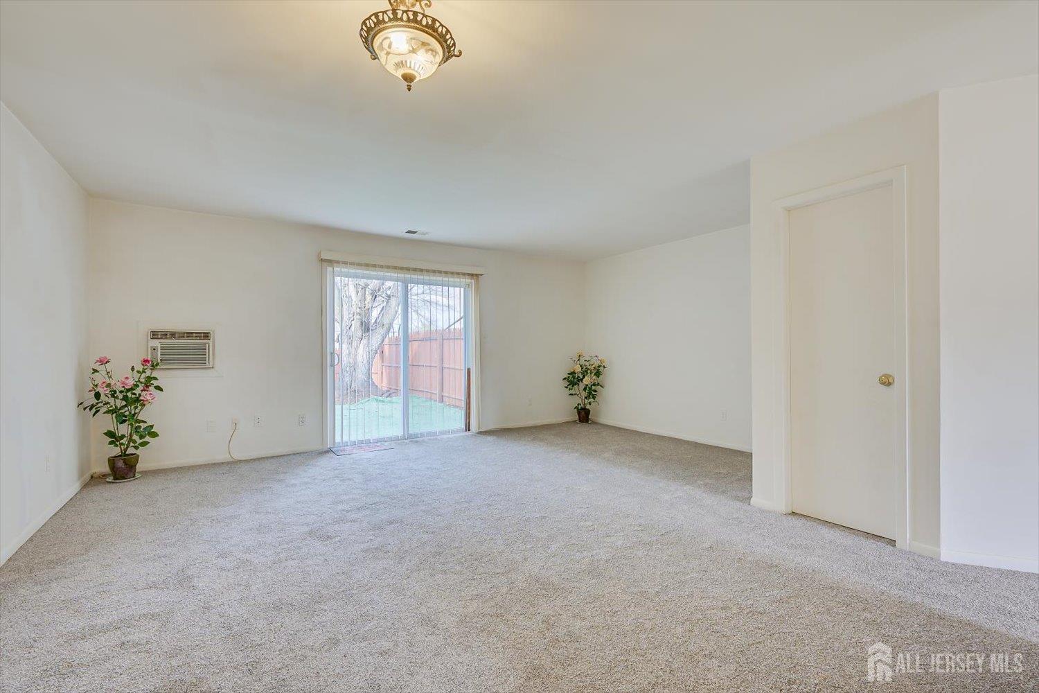 112 Redbud Road Piscataway, NJ 08854 - Photo 5 of 27 an empty room with windows