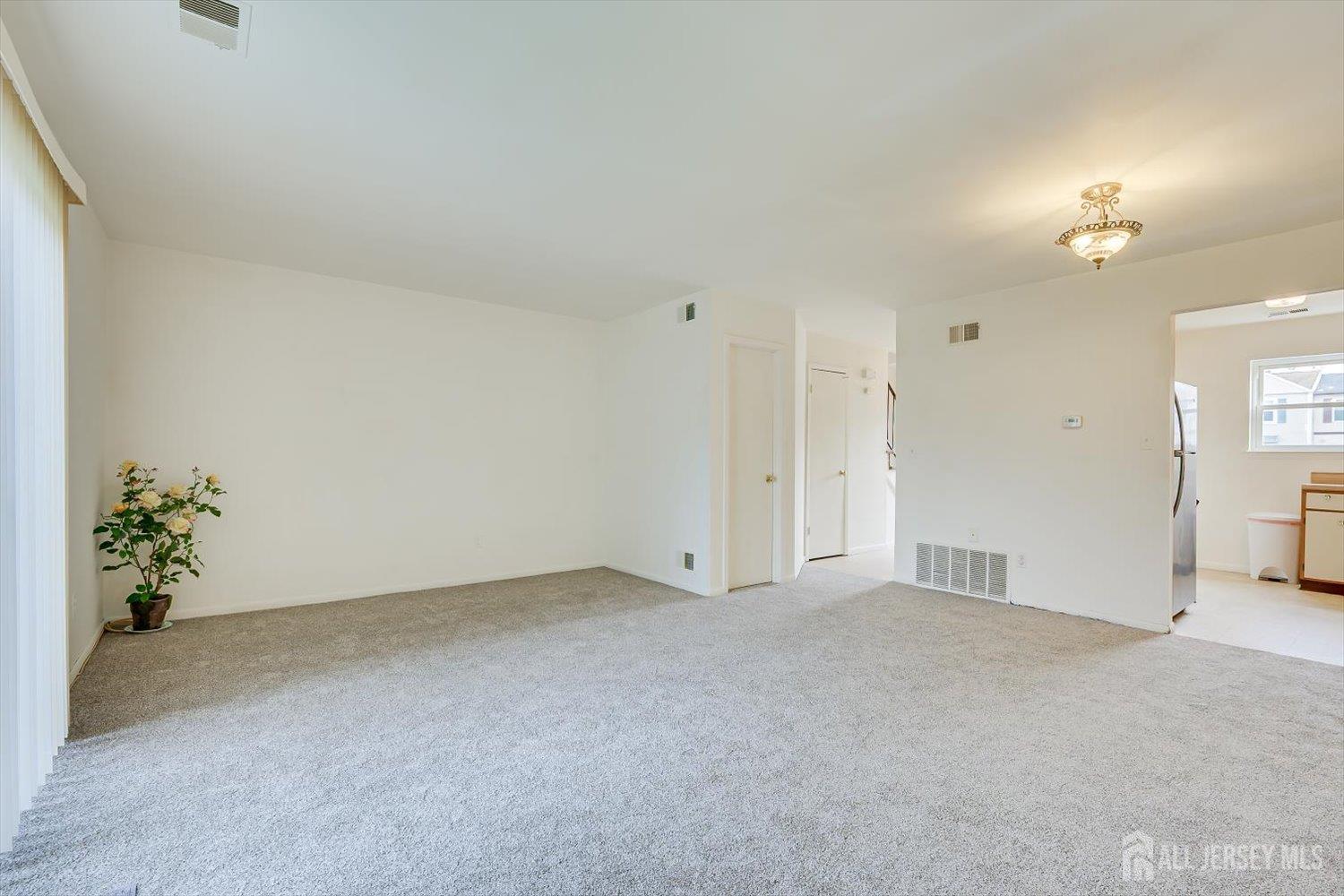 112 Redbud Road Piscataway, NJ 08854 - Photo 6 of 27 a view of an empty room with a window