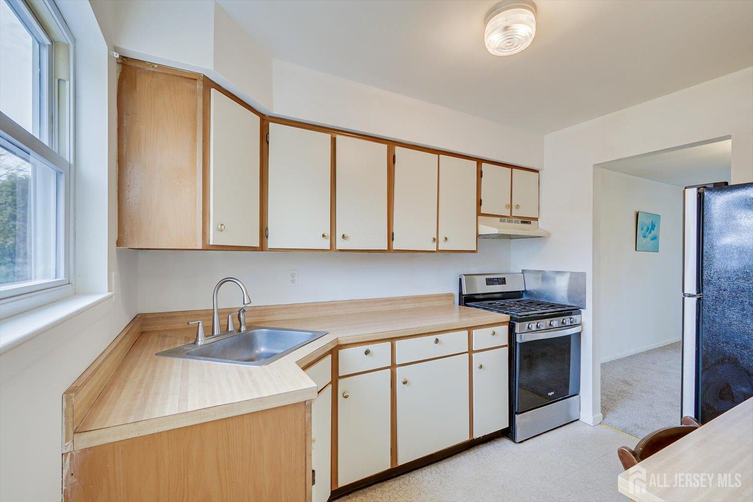 112 Redbud Road Piscataway, NJ 08854 - Photo 10 of 27 a kitchen with stainless steel appliances granite countertop a sink stove and cabinets